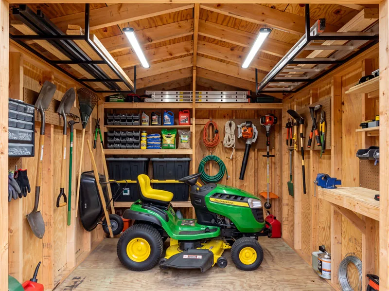 The same cabin fitted out as a guest room with a bed and shower